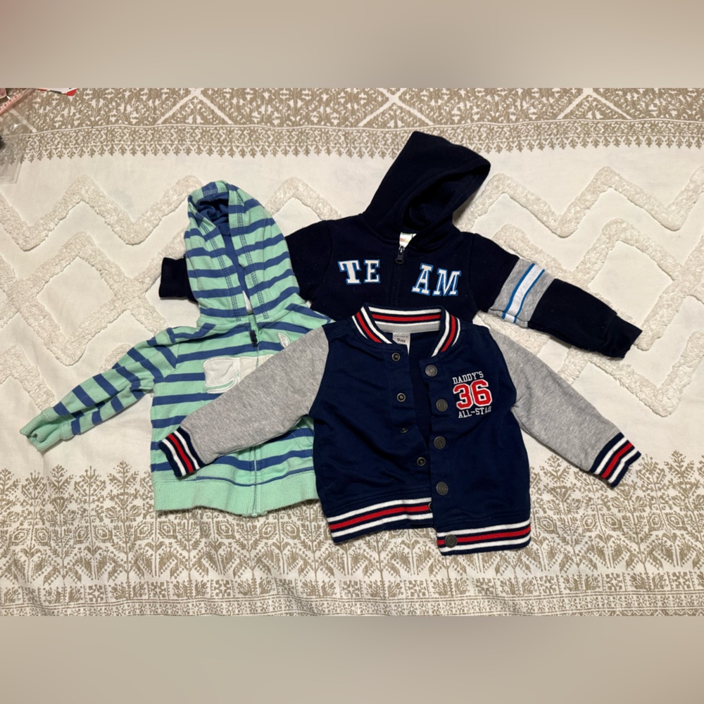 Set of three jackets two Carter’s (9 and 6 months) and one Kidgets (0-6 months)